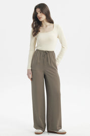 Pantalón mujer holgado verde militar claro con cordón ajustable en la cintura prenda lisa estilo relajado y versátil