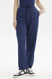 Pantalón buzo mujer pitillo azul sin estampa ajustado con cordón a la cintura y bolsillos laterales corte casual