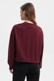 Polerón crop mujer rojo con texto Dream Team London en el pecho estilo casual urbano