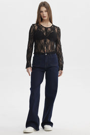 Polera negra de mujer con encaje floral y botones al frente de estilo elegante y manga larga sin estampa lisa