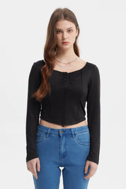 Polera negra ajustada para mujer con botones frontales y manga larga sin estampa lisa elegante y versátil