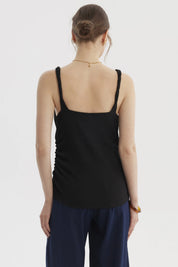 Polera mujer negra de tirantes trenzados diseño liso estilo casual y moderno