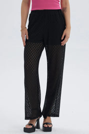Pantalón flare negro con short y patrón zigzag transparente