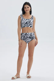 Traje de baño mujer tiro alto blanco con estampado negro y aberturas laterales