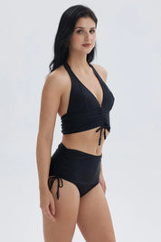 Traje de baño negro de mujer con peto y escote en V