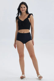 Traje de baño negro con top de vuelos y textura para mujer