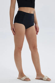 Traje de baño mujer negro de una pieza con diseño de cintura alta y fruncidos laterales