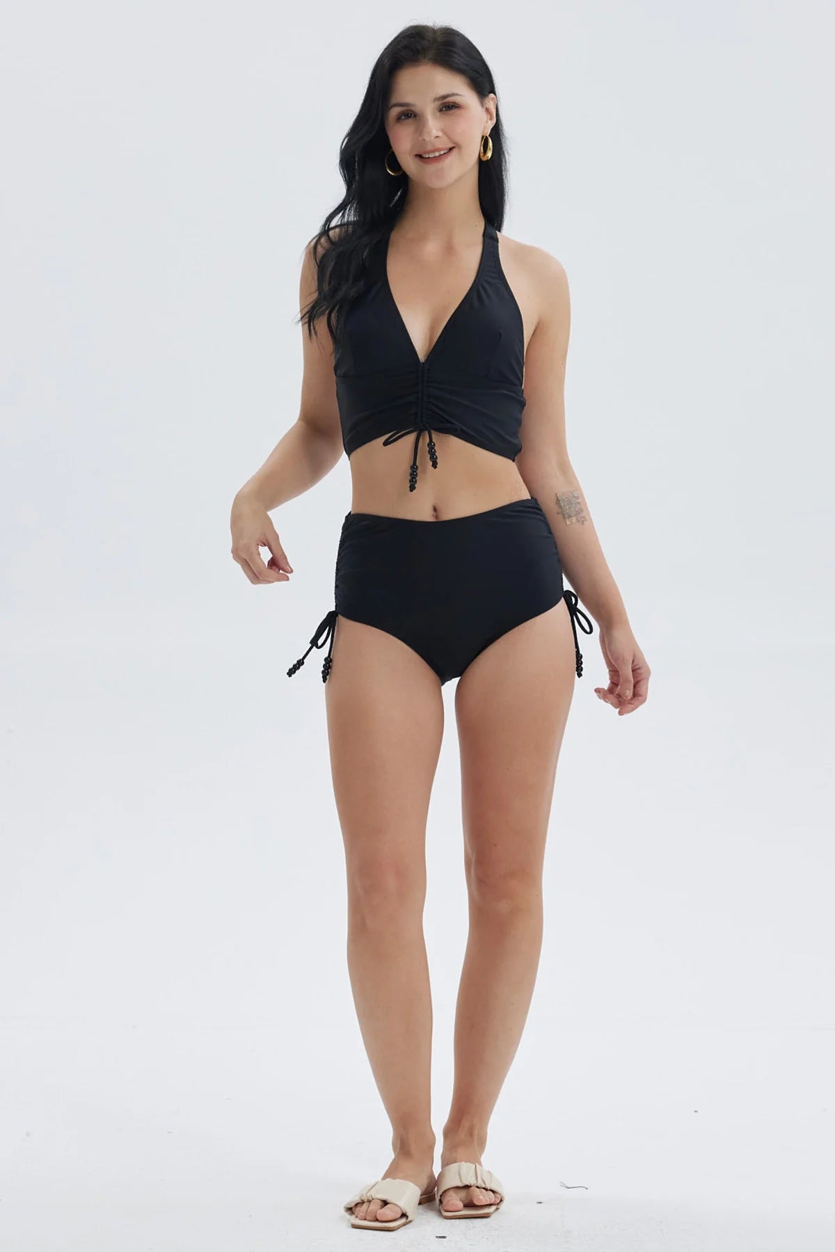 Traje de baño mujer calzón tiro alto negro con detalles de lazo en los costados