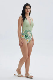 Traje de baño entero verde con estampado floral tropical en la parte inferior