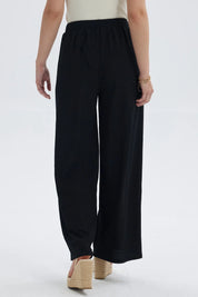 Pantalón mujer negro con textura y pretina elástica visible