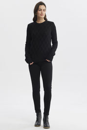 Sweater mujer negro con diseño de ondas en relieve estilo casual sin estampa visible