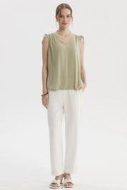 Blusa verde de mujer sin mangas con tiras ajustables en los hombros y diseño liso casual elegante