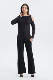 Polera negra de manga larga con nudo en el hombro y diseño liso ideal para un look elegante y moderno