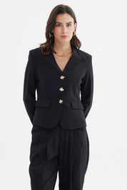 Blazer negro de mujer con botones dorados y bolsillos delanteros estilo formal elegante sin estampa lisa