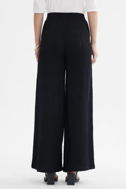 Pantalón mujer wide leg negro sin estampa tejido texturizado corte amplio elegante y versátil para ocasiones formales