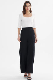 Pantalón mujer wide leg negro sin estampa tejido texturizado corte amplio elegante y versátil para ocasiones formales