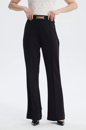 Pantalón negro mujer con aplicación metálica dorada en el cinturón estilo formal sin estampa lisa y elegante