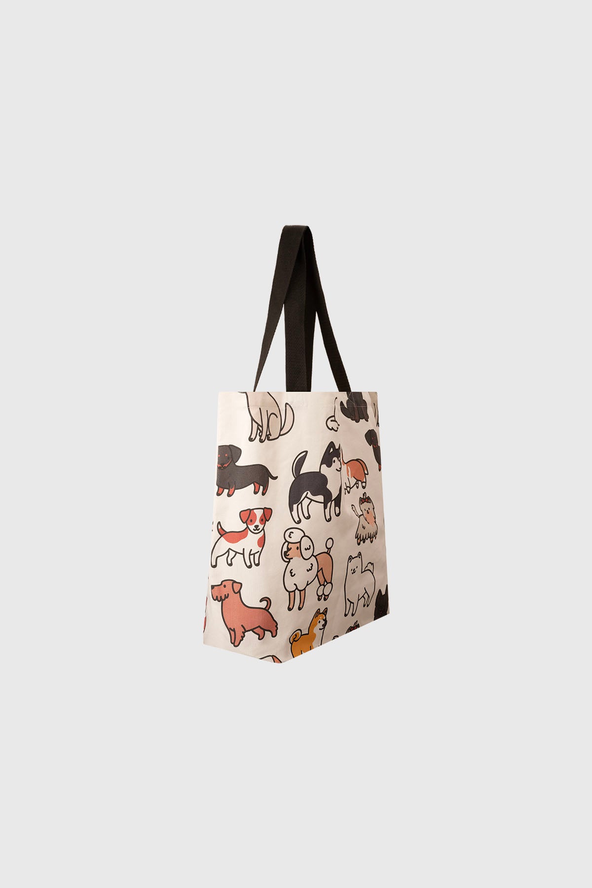 Bolsa grande blanca con estampado de perros en estilo caricatura de colores diversos sobre fondo claro sin texto visible