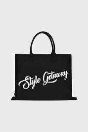 Bolsa negra de poliéster con asas y texto blanco Style Getaway en el frente estilo moderno centrado