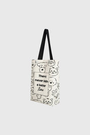 Bolsa pequeña crudo con diseño de caras de perros y gatos en negro texto en el centro que dice There's never been a better time