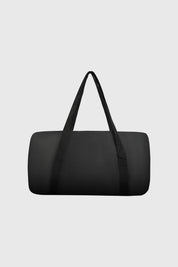 Bolsa plegable negra lisa con asas largas diseño simple funcional y minimalista sin estampa visible