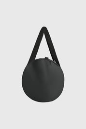 Bolsa plegable negra lisa con asas largas diseño simple funcional y minimalista sin estampa visible