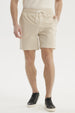 Short de baño hombre liso beige con cordón blanco visible en la cintura diseño sencillo sin estampas