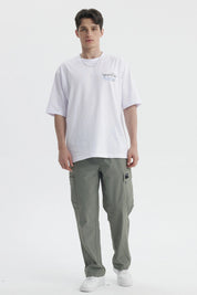 Polera oversize blanca con texto Sport Club en el pecho estilo casual sin estampa adicional