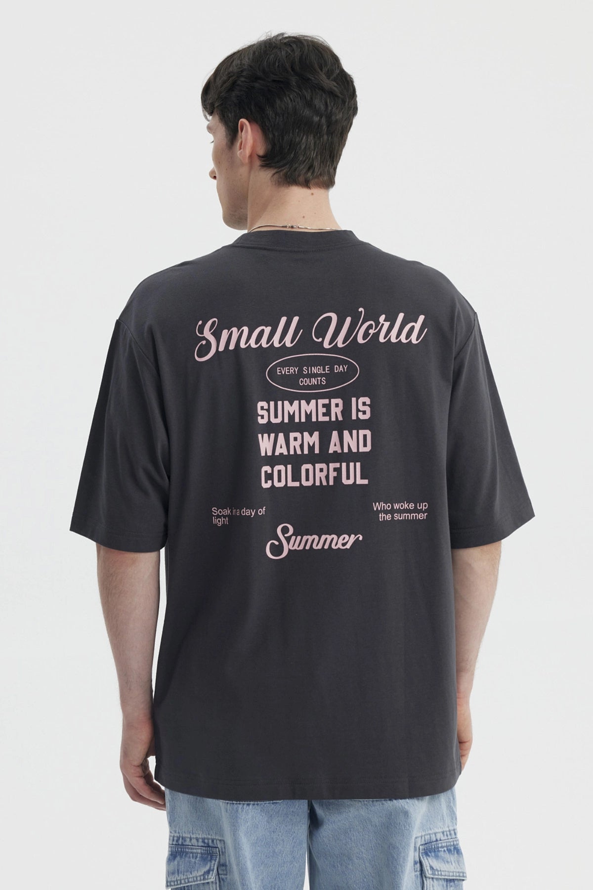 Polera oversize marengo con texto Good Weather al frente estilo casual y relajado perfecta para días de verano