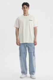 Polera slim beige de hombre con texto decorativo en el pecho estilo casual lisa y de algodón ideal para uso diario