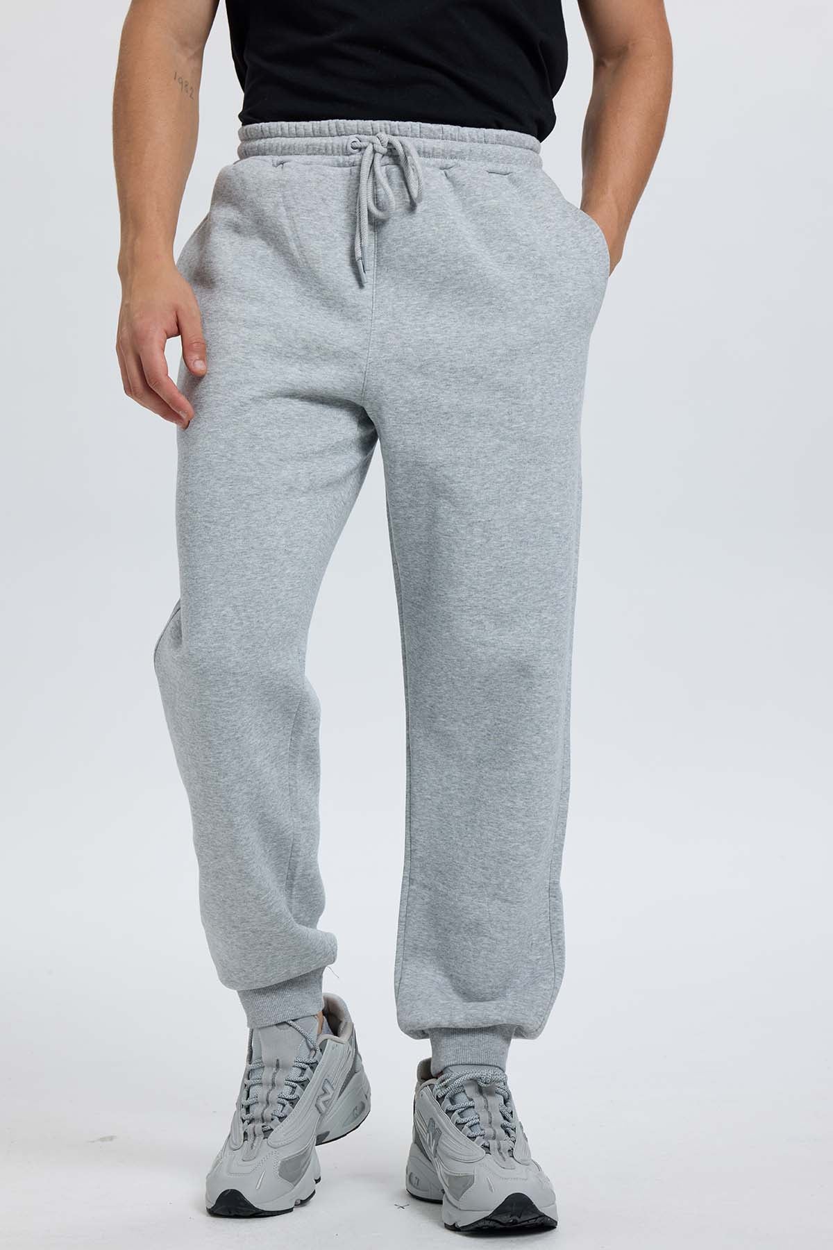Pantalón buzo hombre jogger gris melange