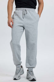 Pantalón buzo hombre jogger gris melange
