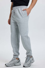 Pantalón buzo hombre jogger gris melange