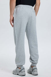Pantalón buzo hombre jogger gris melange