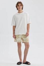 Short de baño hombre tropical beige con estampado floral en tonos claros y cintura ajustable