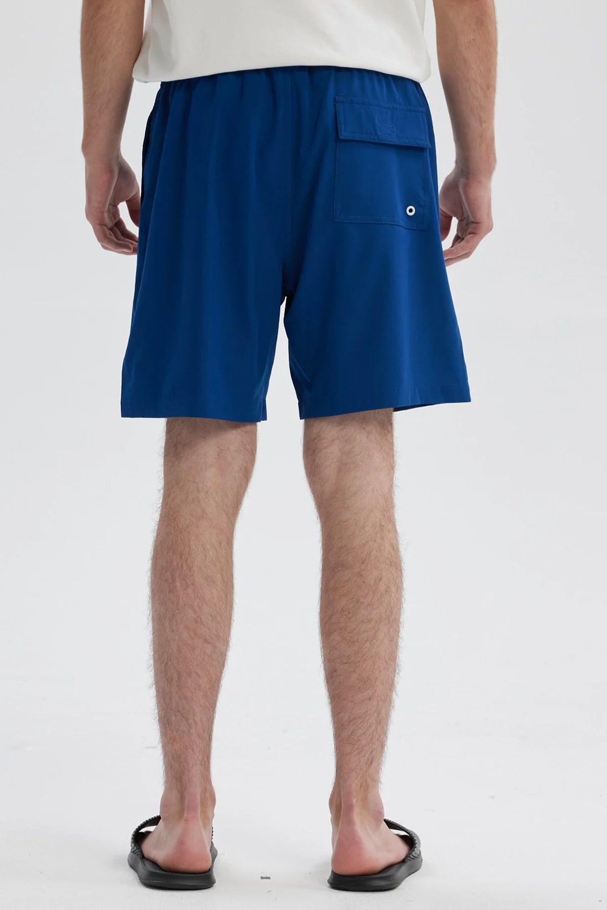 Short de baño azul para hombre con cordón blanco y logo 'FREE' en la pierna