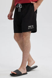 Short de baño hombre liso negro con cordón blanco y detalle gráfico en pierna