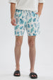 Short de baño blanco con estampado de hojas azules y verdes diseño fresco