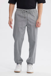 Pantalón jogger gris para hombre con cintura elástica y cordón ajuste sin estampa diseño liso y casual