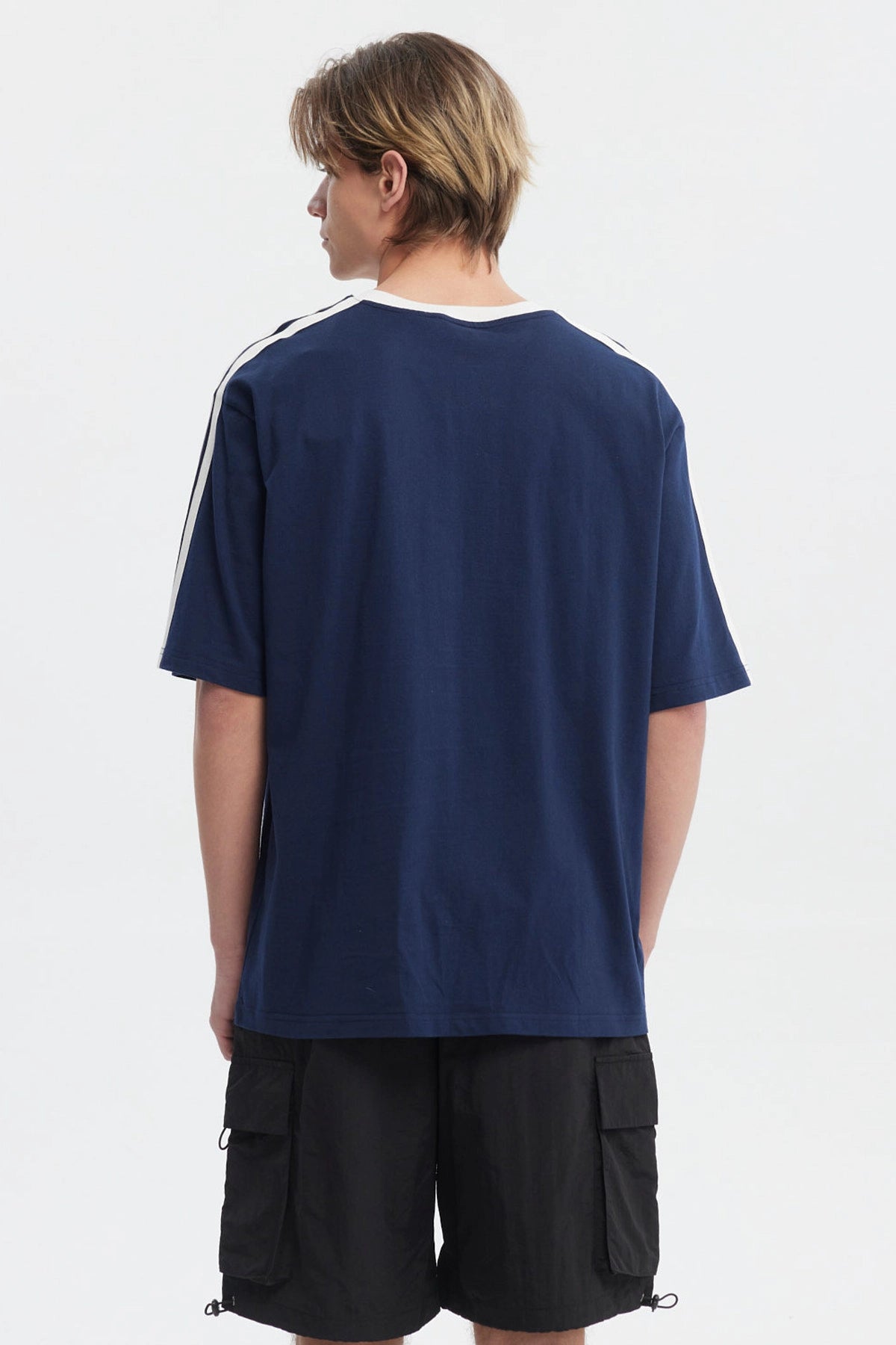 Polera oversize azul para hombre con texto Team Full Ahead Cycling en el frente estilo deportivo