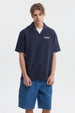 Camisa oversize azul con logo Youth Culture en el pecho estilo casual y botones frontales sin estampa adicional