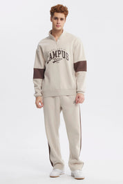 Polerón oversize beige con medio cierre y texto Campus 1968 en el pecho estilo universitario casual y cómodo