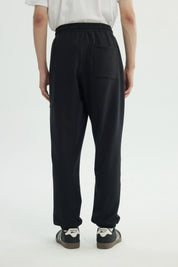 Pantalón Buzo Hombre Pitillo Negro