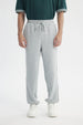 Pantalón Buzo Hombre Pitillo Gris Melange